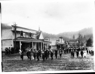 A community band marching down Greenville Main Street in 1915